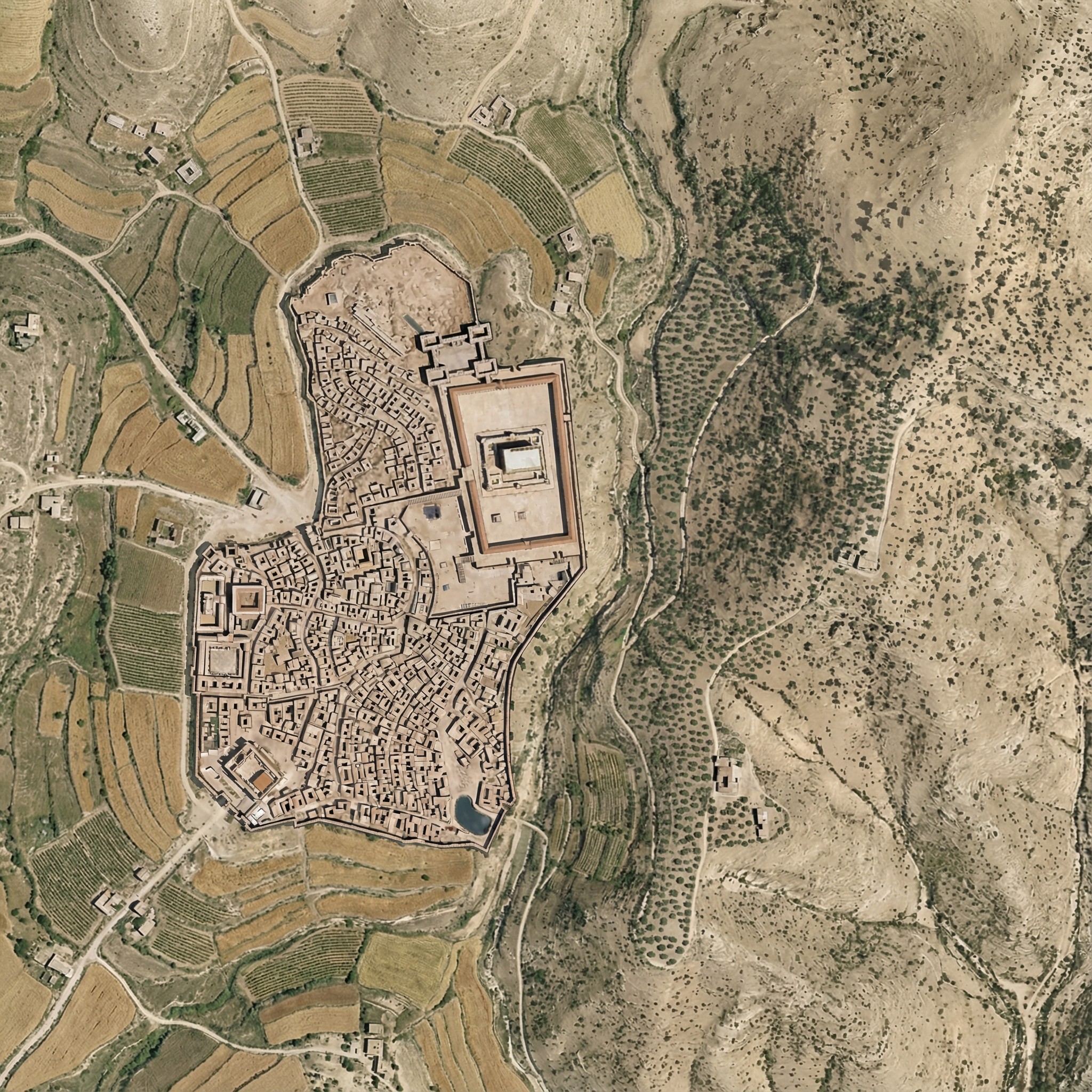 Jerusalem embedded into the landscape with agriculture and small structures outside the city.