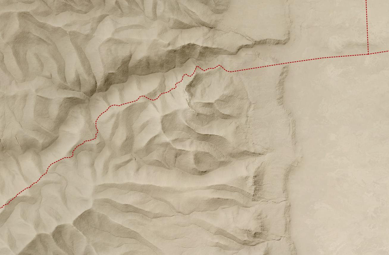 A hillshade over a colored background with a road going west from Jericho.