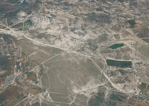 Archive record 340: overview of the terrain southwest of el-Kubebe, including Khirbet Hermas with the pool and Zernuka