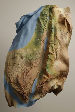  A flowing map where the terrain folds and bunches like a loose sheet — mountains as sharp peaks in the cloth, valleys where it dips and ripples — soft, kinetic, sculptural.