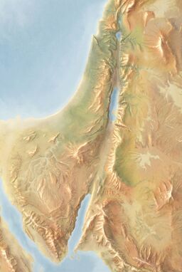  A map where the spines of mountains and hills are feathered with brightness — highlights along ridges — hinting at the land’s rise without shouting it.