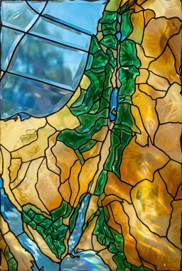  Inspired by stained glass: each landform rendered as a slightly beveled, colored glass pane. Mountains in deep emerald, plains in sandy yellows, water in translucent azure. Light-reflecting and bold.