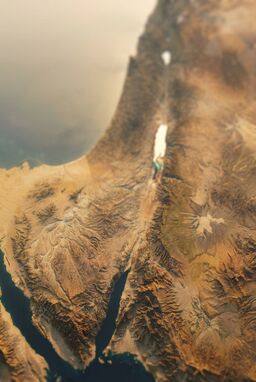  A cinematic close-focus render where foreground mountains are sharply detailed and background terrain melts into a soft blur — valleys glowing, rivers glinting, a sense of vastness but intimacy.