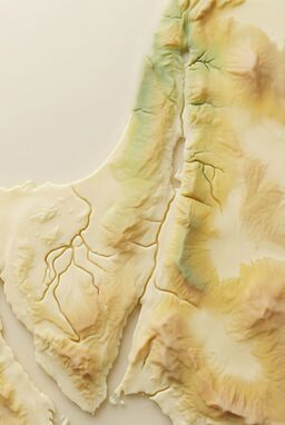  A matte, smooth map where hills rise like gentle silicone ridges, rivers groove through buttery surfaces — squishy but structured — a playful, sensory reimagining of the land.
