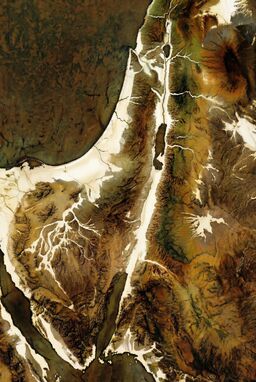  A map where wax is applied before paint to protect river valleys and coasts — waxed areas stay bright, while the land darkens and roughens — rivers gleaming clean through wild textured uplands.