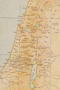 Cropped flat Bible atlas map with warm tan land, pale gray-green water, orange-brown manual relief, dark serif labeling, and solid graticule lines.