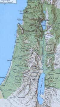 Full-color Bible atlas style with pale blue water, black serif labeling, large spaced capital regional names, dense manual shaded relief, and green/pale landcover tints. Scale text is visible at the top edge but intentionally not included as typography.