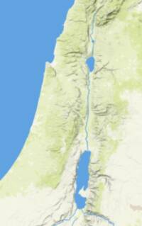 Digital shaded-relief landcover basemap with blue water bodies and drainage, pale arid land tones, and green vegetation patches.