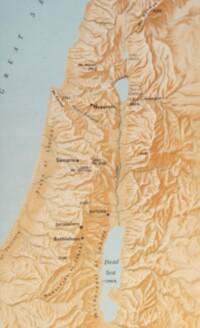 Flat tan land base with manual brown relief shading; water is pale blue-gray and labels are printed in dark brown to black ink.