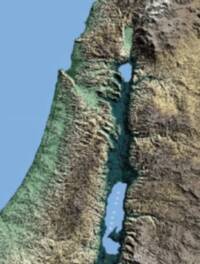 Digital shaded hypsometric elevation map of the Levant with blue water bodies, green-to-tan land elevation tints, strong terrain shadows, and a pale dotted boundary line in the Jordan rift area.