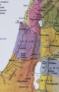 Colored region tints and diagonal hatching are overlaid on shaded bare-earth relief. Labels use mostly serif type, with blue italic water and drainage labels and dark city, region, mountain, boundary, and route text.