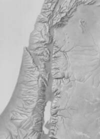 Monochrome bare-earth shaded-relief map focused on the Jordan Rift, with gray inland water bodies, white coastal water, and manually shaded escarpments and drainage.