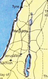 The visible map portion uses a flat yellow land base, blue textured water, heavy irregular black shorelines, and a black network of solid and dashed lines over the land.