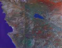 False-color satellite basemap with overprinted pale settlement labels, orange mountain names, blue-green river names, dark grid lines, and yellow numbered site markers.