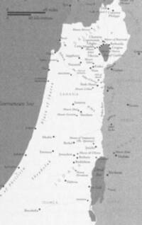Monochrome grayscale atlas map with a white highlighted land strip, medium-gray surrounding water and neighboring areas, dark gray place labels and symbols, and lighter gray large regional names.