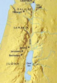 Flat yellow land base is combined with brown digital shaded-relief texture; water and drainage are rendered in pale blue to blue-gray.