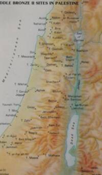 The map uses hypsometric elevation tinting with manual shaded relief, teal hydrography, and dark filled-dot settlement symbols.