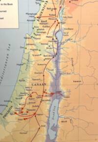 The map combines pale blue-gray water, dark blue hydrography, hypsometric land tints, black dashed regional boundaries, and dark red campaign movement arrows over a graticule.