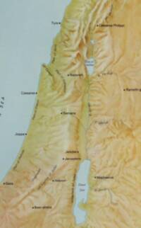 Pictorial shaded relief and landcover tints dominate the map, with pale blue-green water and dark brown-black labeling.