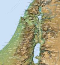Oblique shaded-relief hypsometric basemap with dense white place labels and yellow uppercase region names over the terrain.