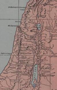Full-color flat Bible atlas style with pink-tan land, gray-green water, dark brown-black typography, hachured relief, and a visible rectangular grid.